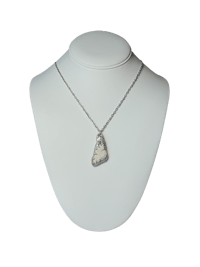 a necklace with an image of a dog on it