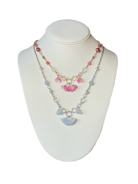 a necklace with blue, pink, and white crystals
